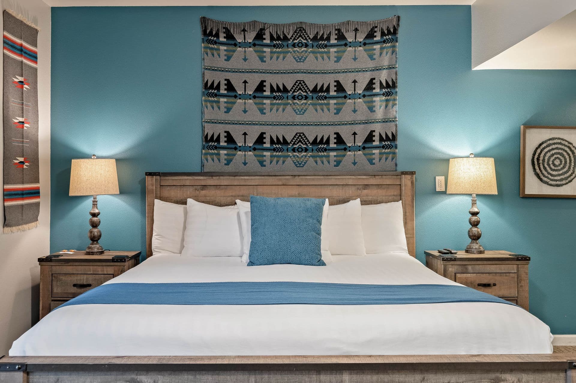 bed shown with blue accent wall behind